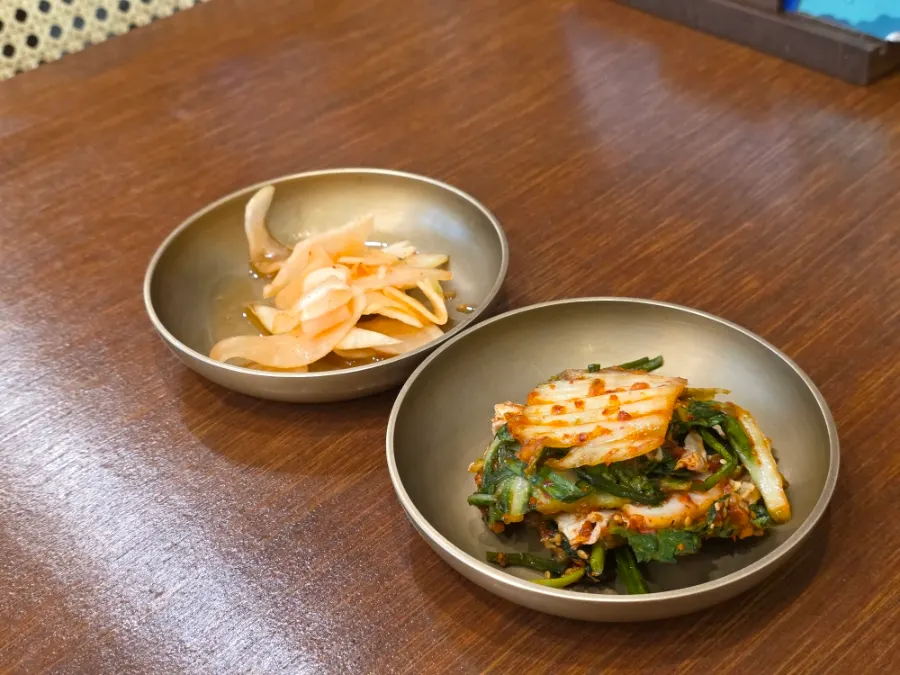 Chopsticks and side dishes on the table