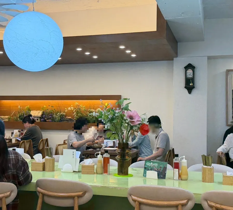 Large shared table in the middle of the restaurant