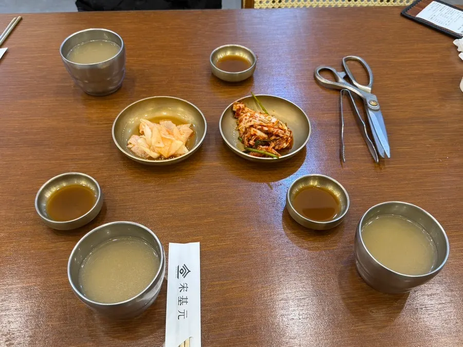 Table set with basic side dishes and ujeon sauce
