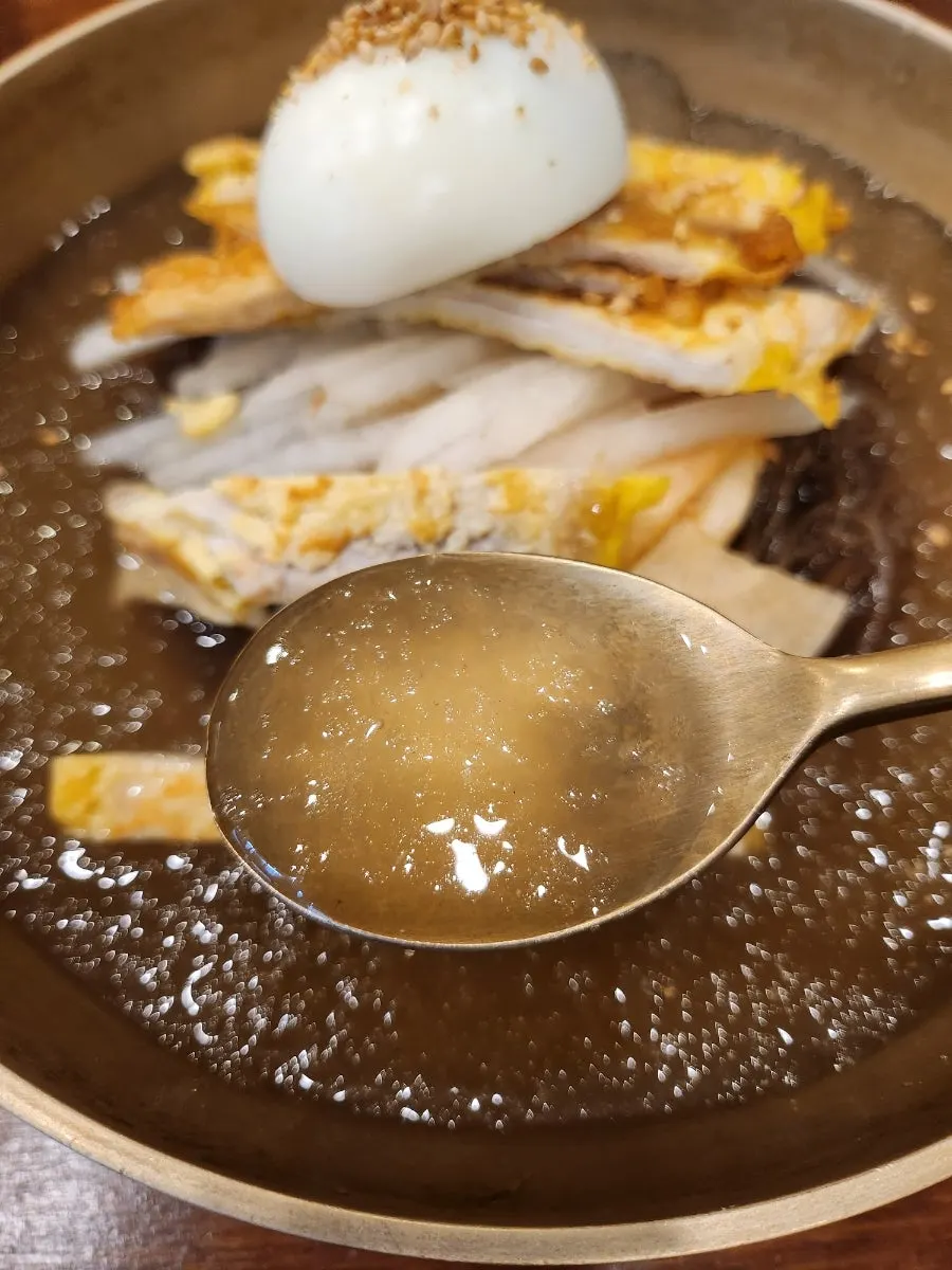 Water naengmyeon noodles lifted up