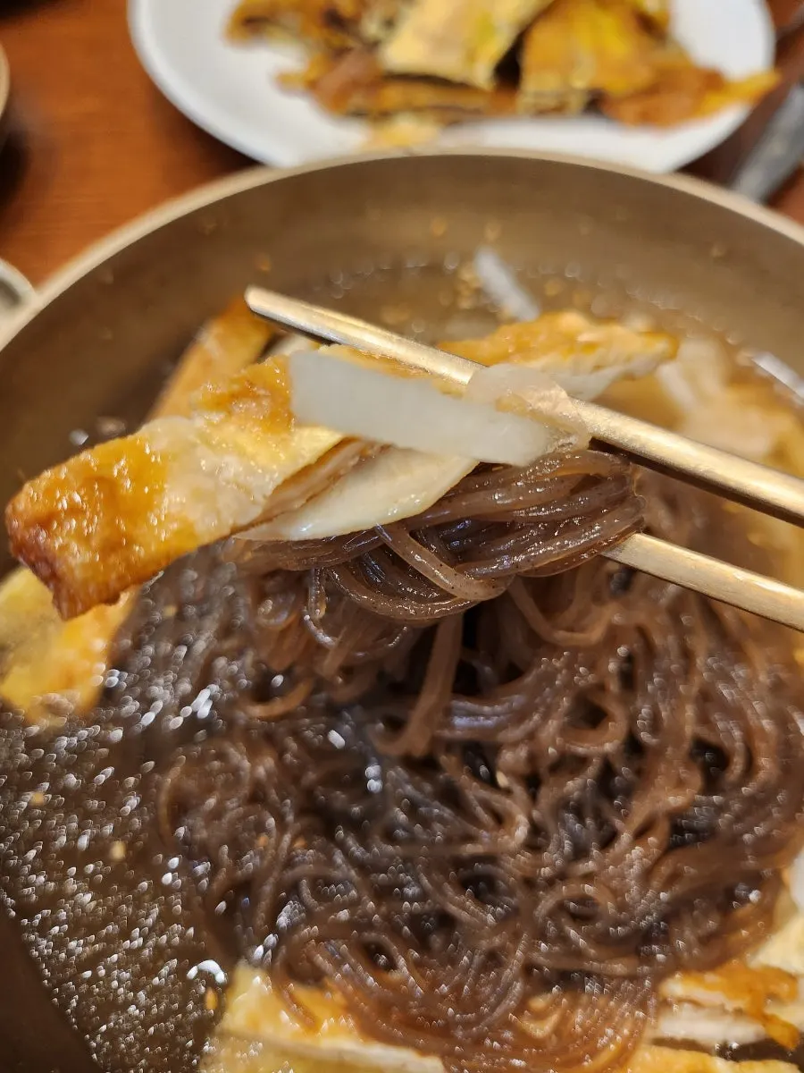 Close-up of Jinju water naengmyeon noodles and toppings