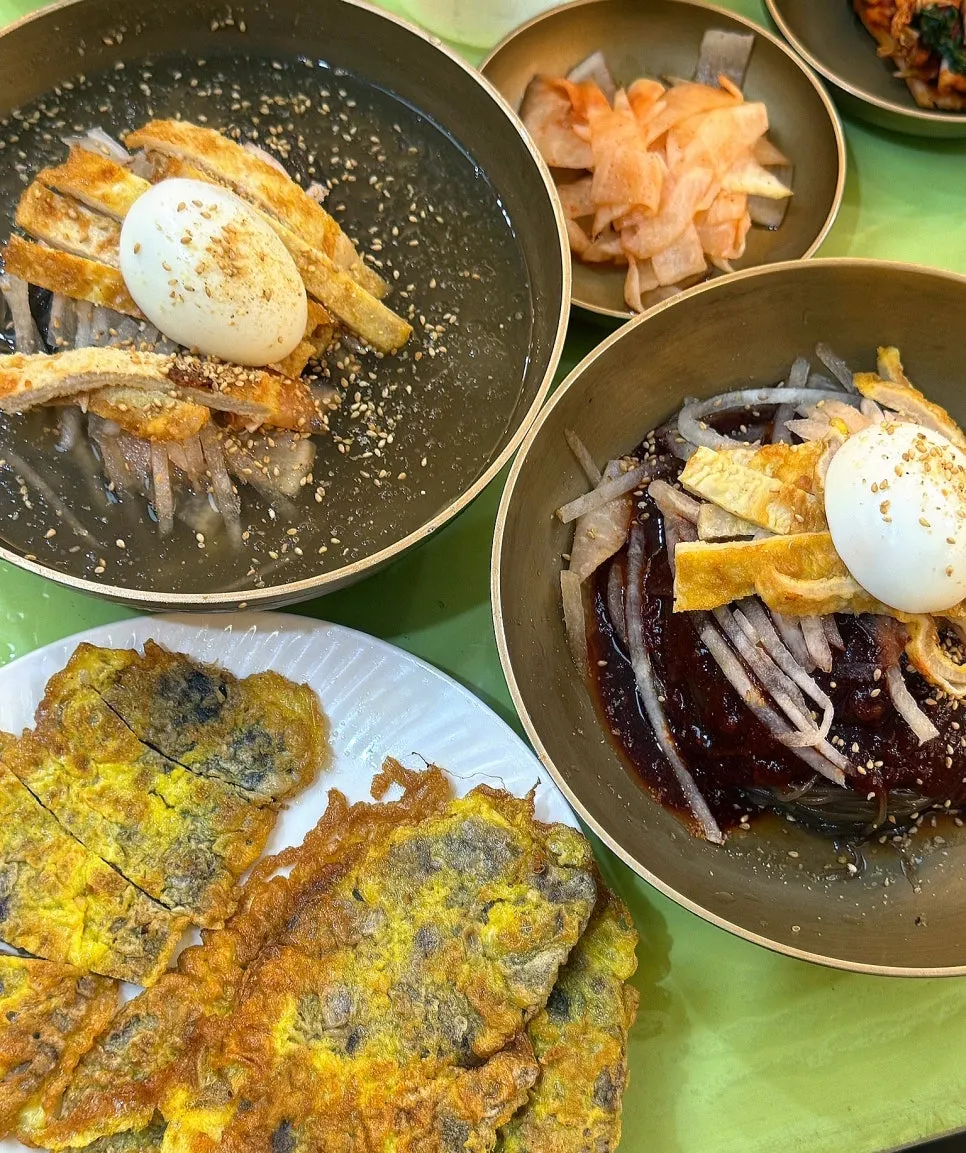 A piece of yukjeon dipped in soy sauce