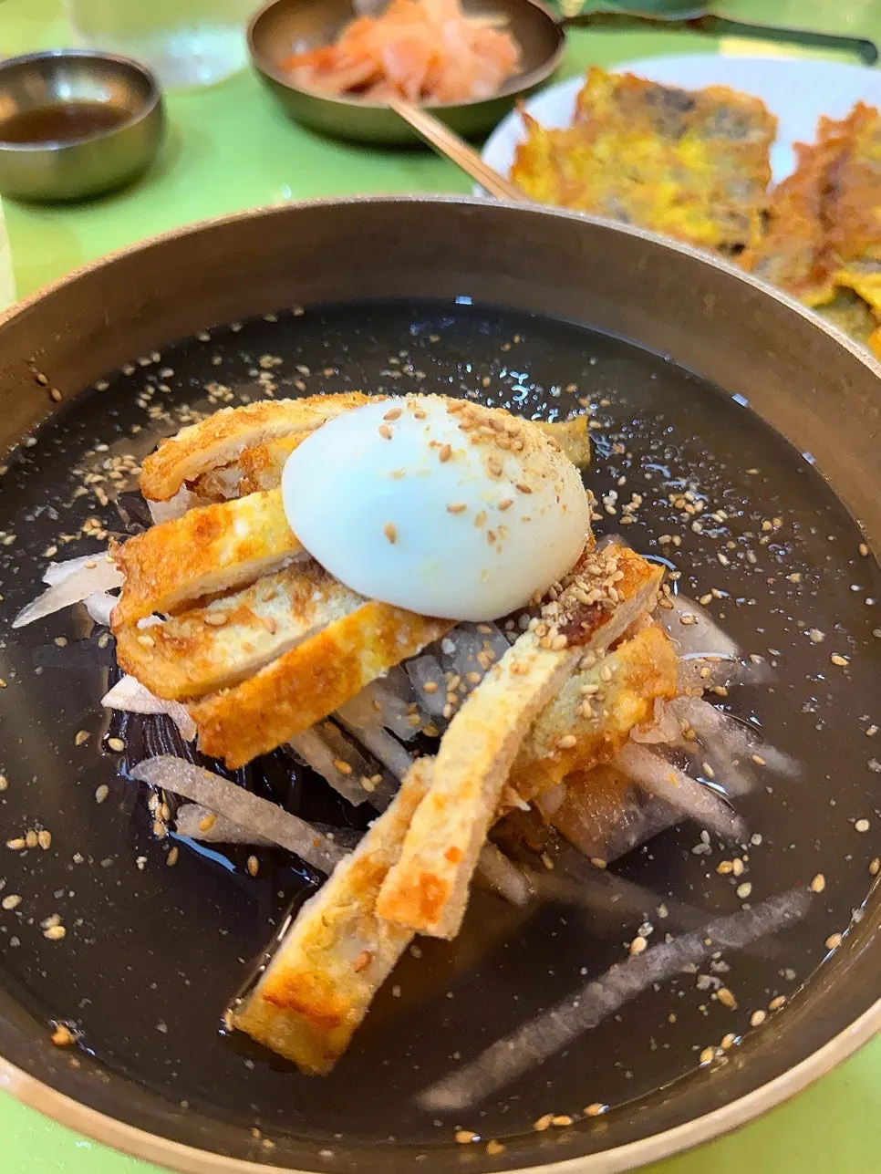 Jinju mul-naengmyeon piled high with toppings