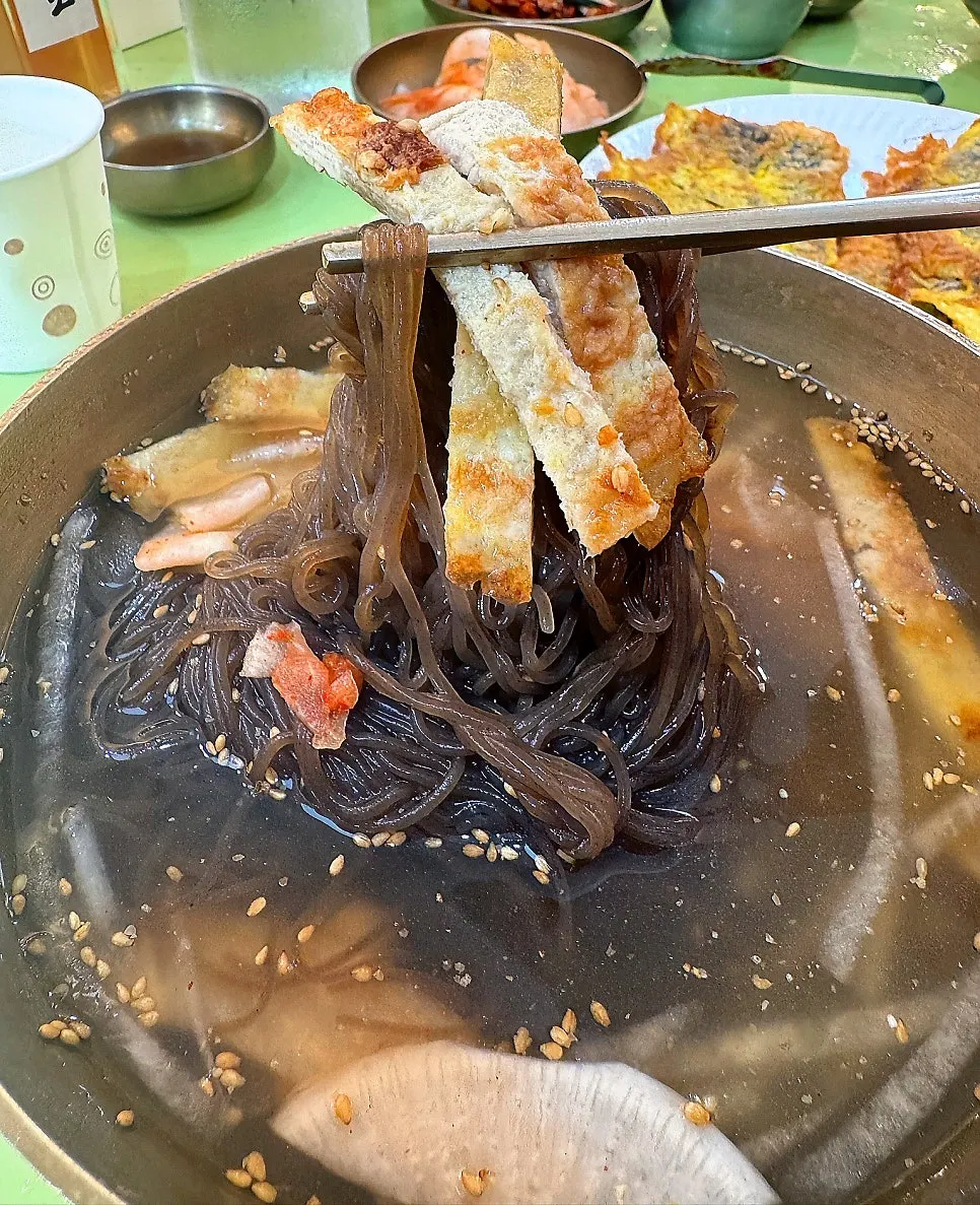Chewy buckwheat noodles lifted with chopsticks