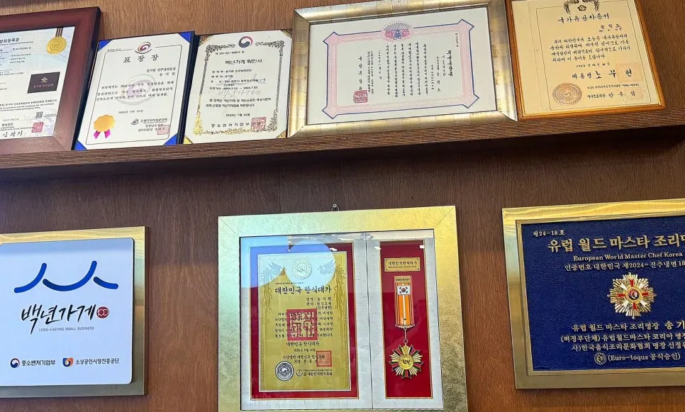 A sign introducing the restaurant's Korean Culinary Master