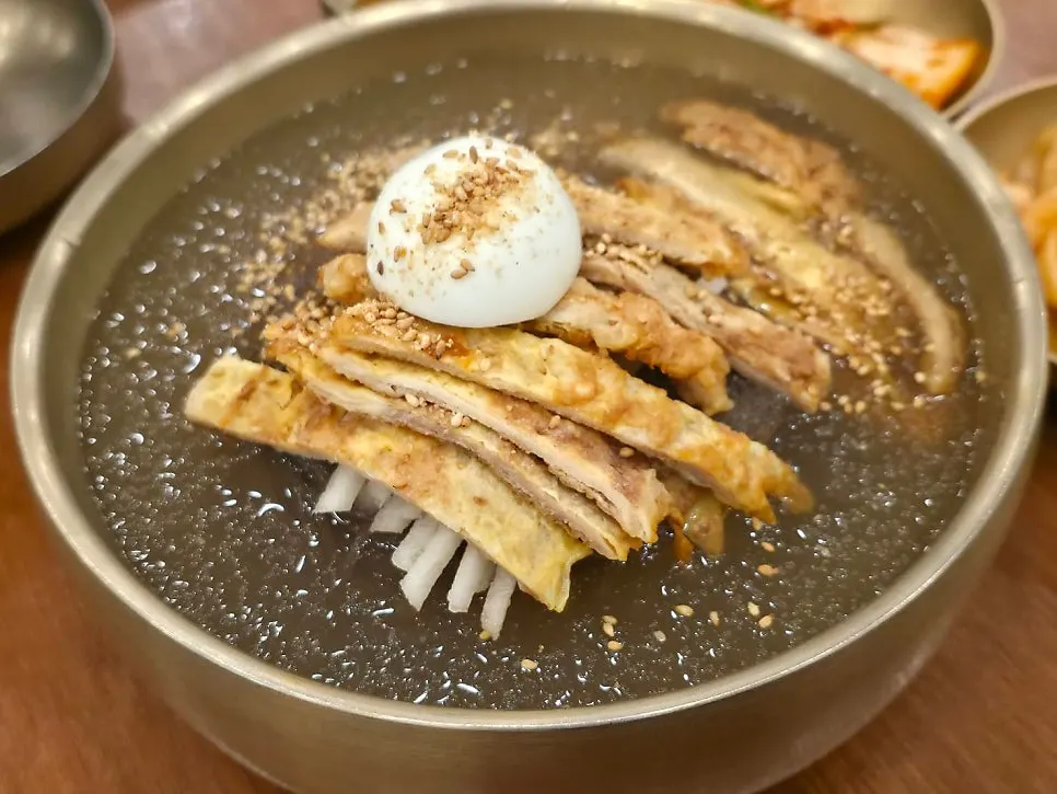 Close-up of the yukjeon garnish unique to Jinju naengmyeon