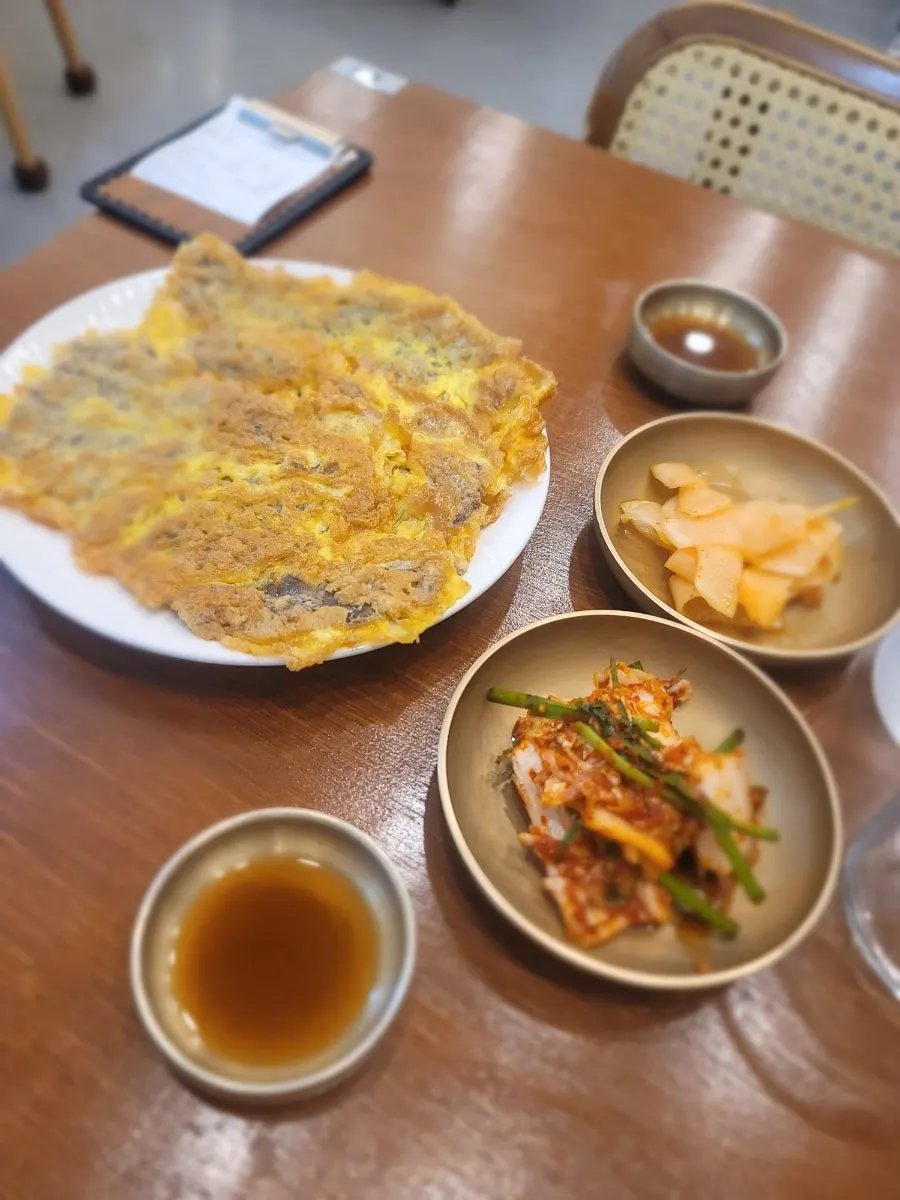 Table set with ordered naengmyeon and yukjeon