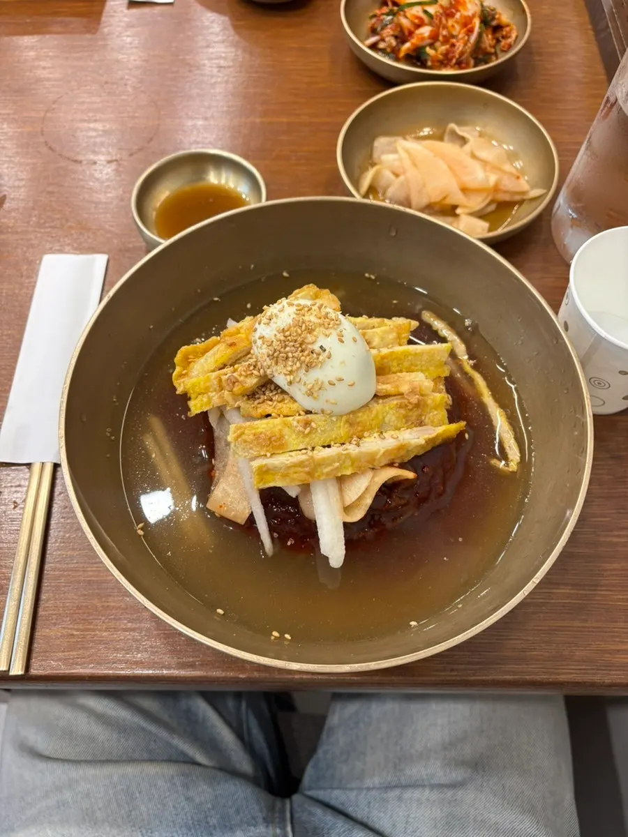 Naengmyeon table setting with side dishes