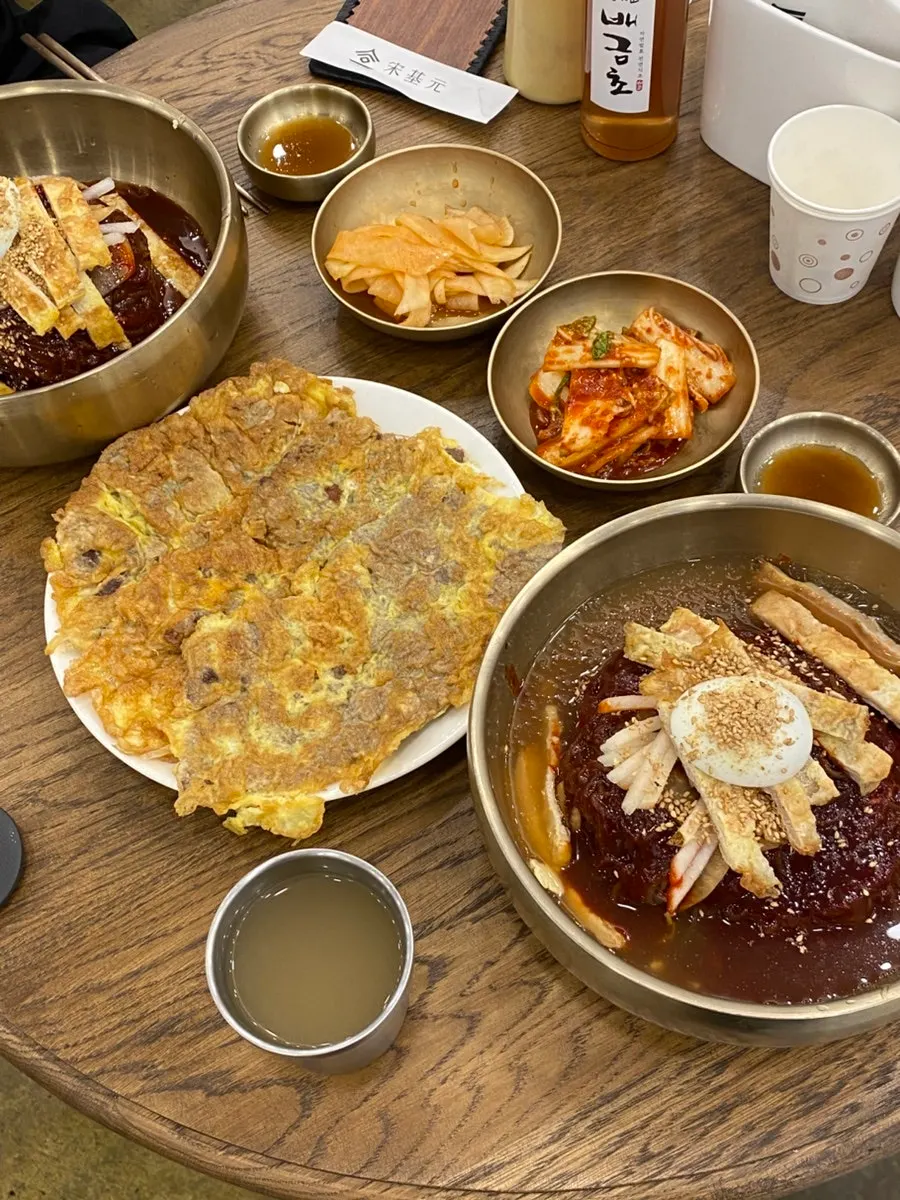 Two bowls of naengmyeon in the large portion size