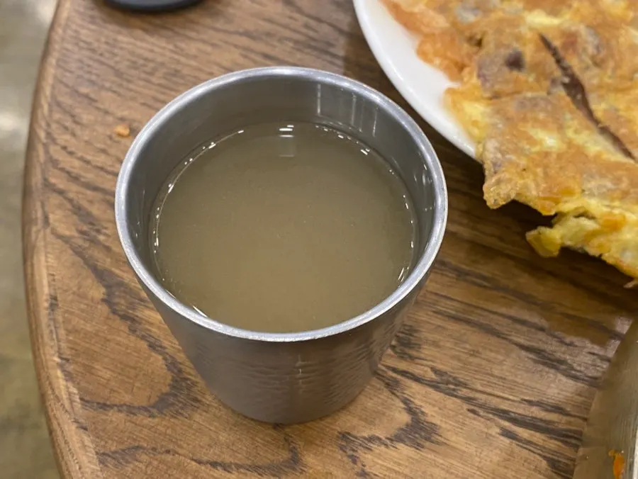 A cup of warm broth for a palate cleanser