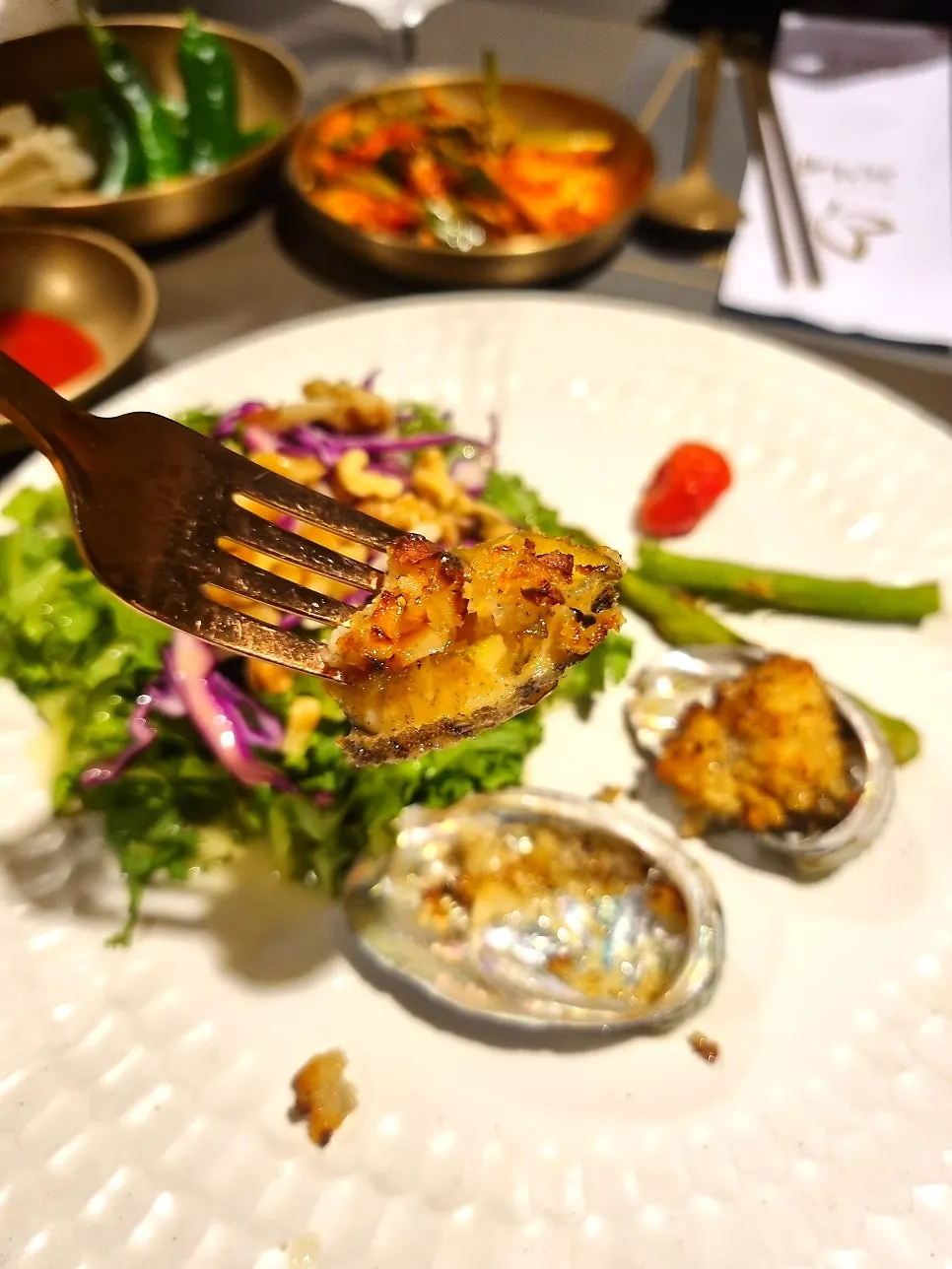 Yuzu-dressed salad with butter-grilled abalone