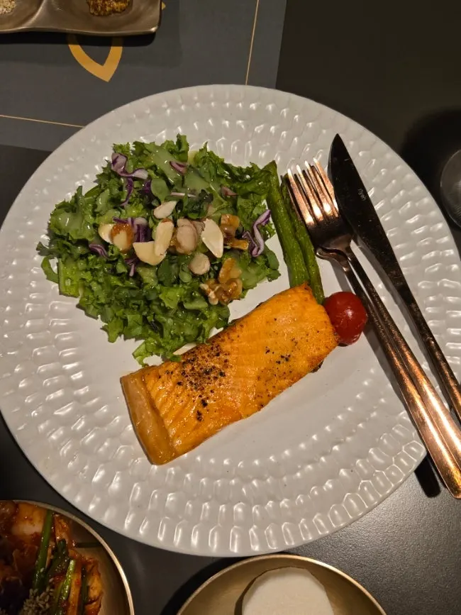 Plate of Psyche's grilled salmon salad appetizer