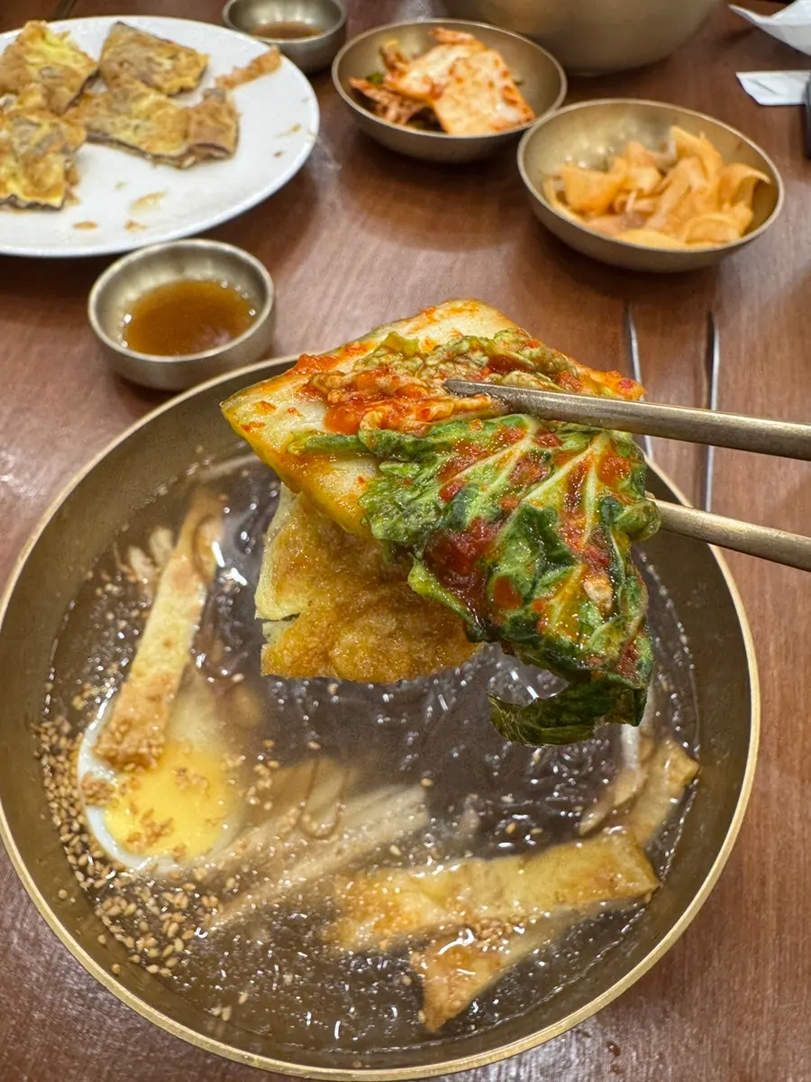 Naengmyeon in its plain broth state, before vinegar is added