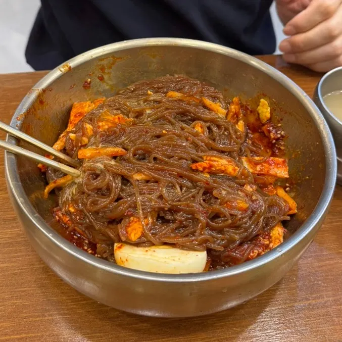Mixed bibim-naengmyeon with pork yukjeon topping