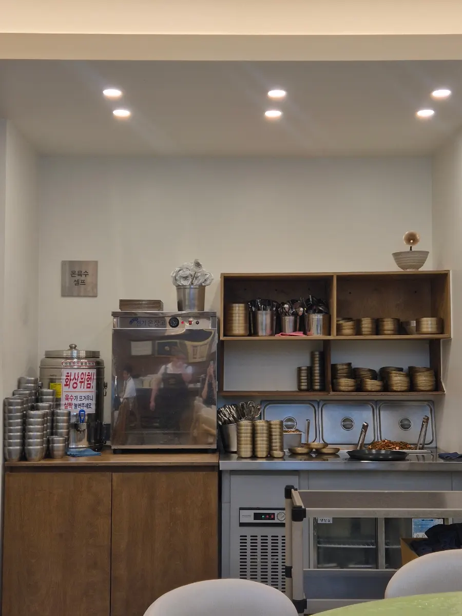 Self-serve corner for extra side dishes and hot broth