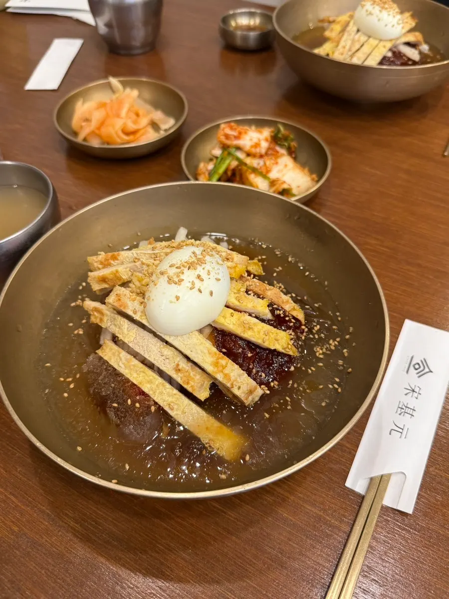 Close-up of buckwheat noodles and toppings in the mixed naengmyeon