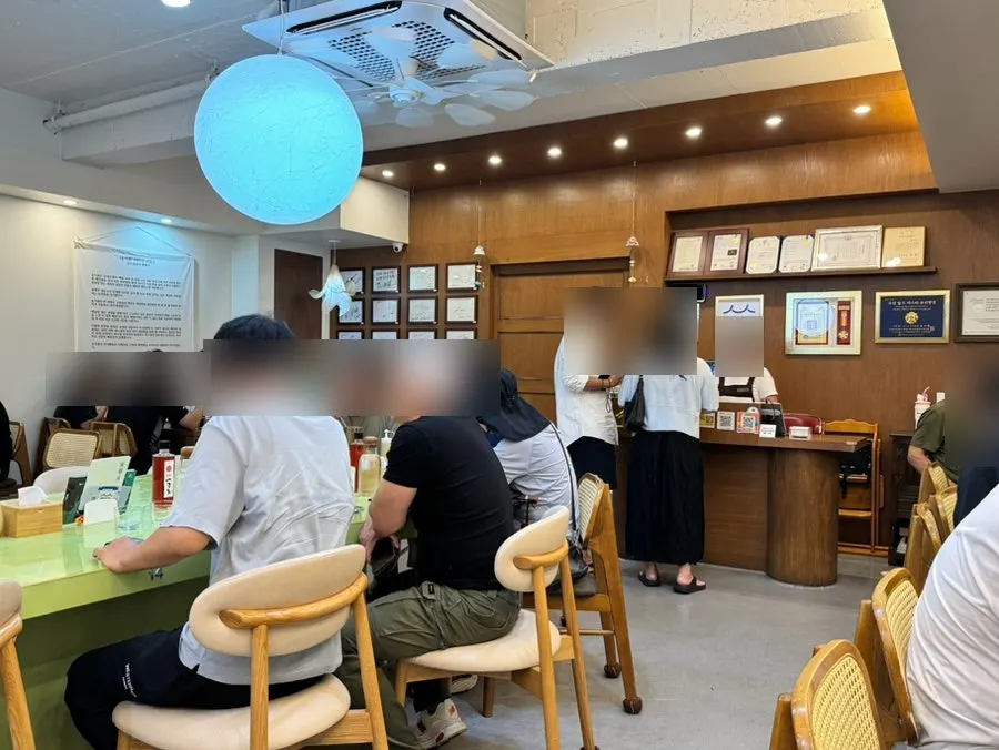Entrance of the naengmyeon restaurant with a lunchtime line forming