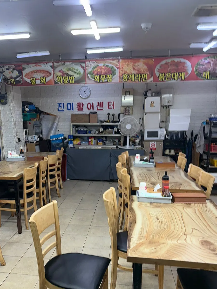 Spacious dining hall seating at Jinmi Hwareo Center
