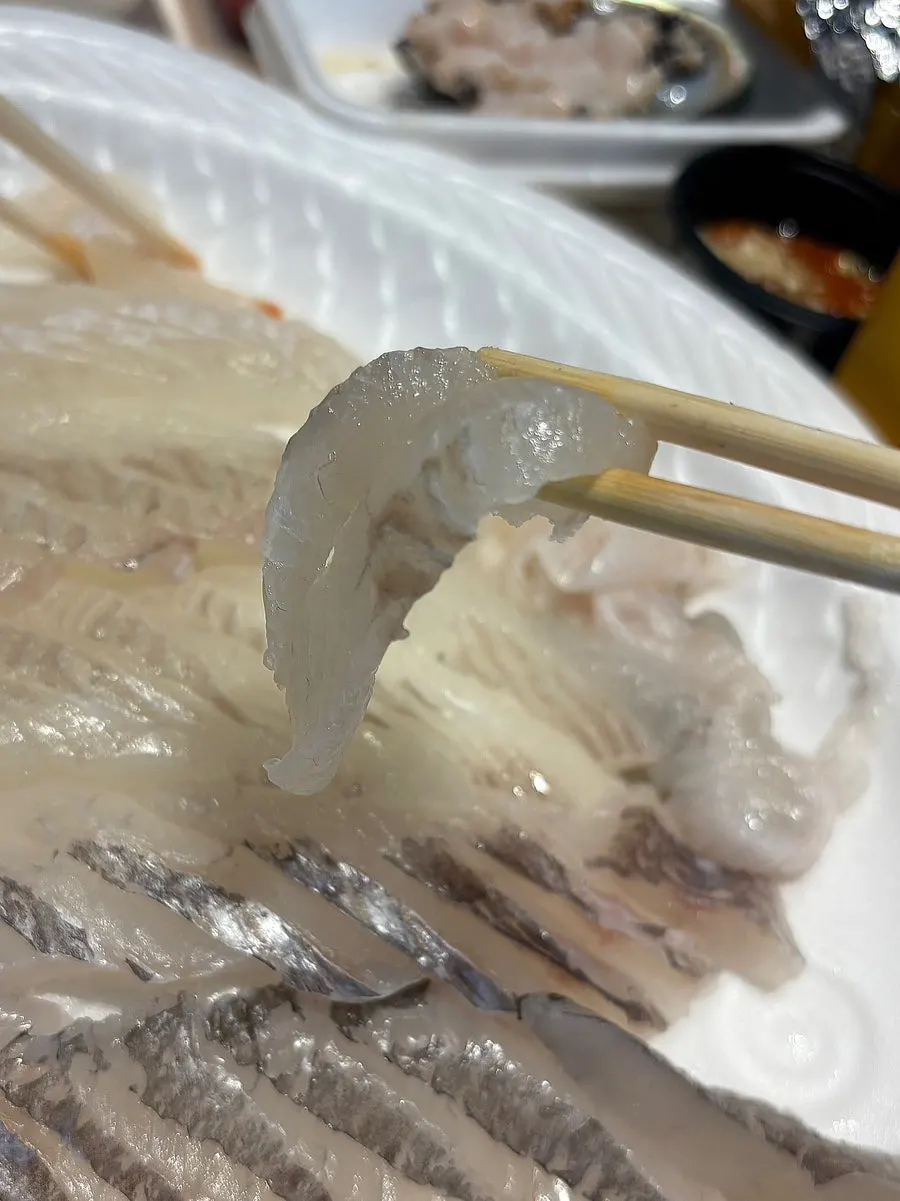 A chewy piece of flounder sashimi