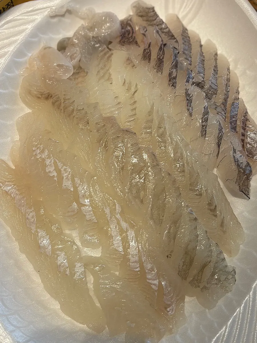 Plate of flounder and rockfish sashimi eaten at our accommodation