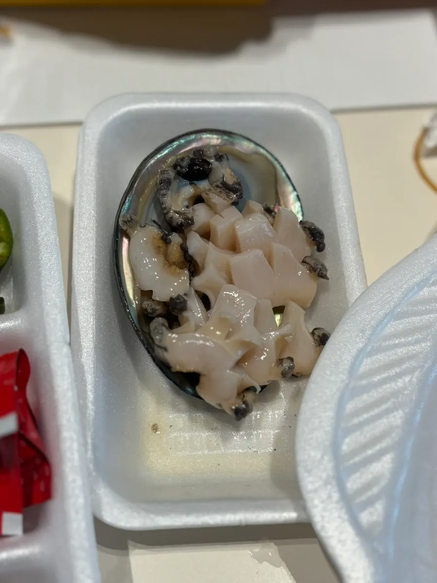 Complimentary abalone sashimi