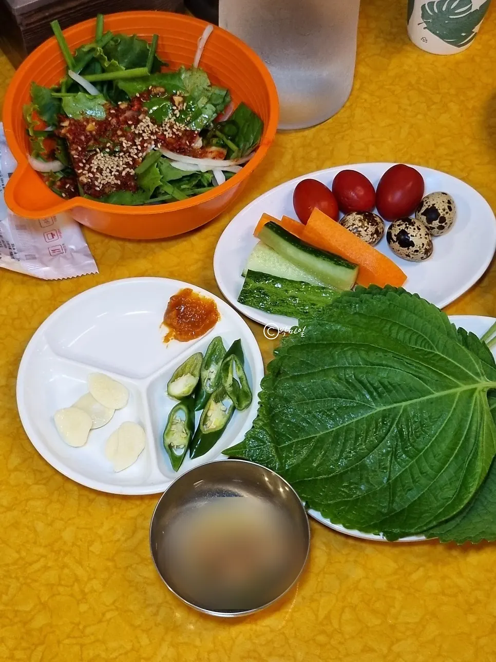 Basic table setting with seasoned vegetables and baek-kimchi