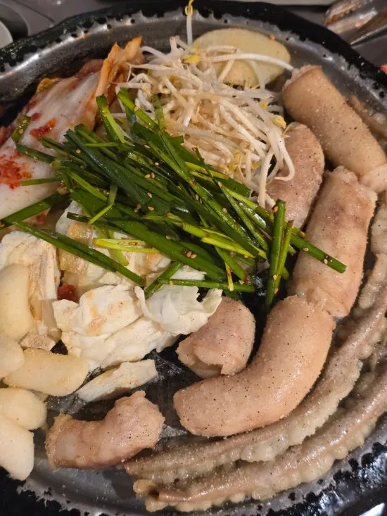 Table with steamed egg and chive salad