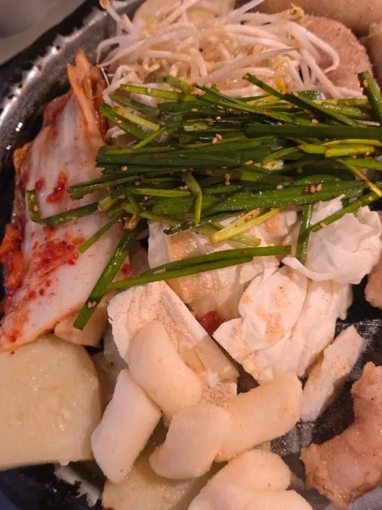 Grill pan piled with beef gopchang and beef daechang