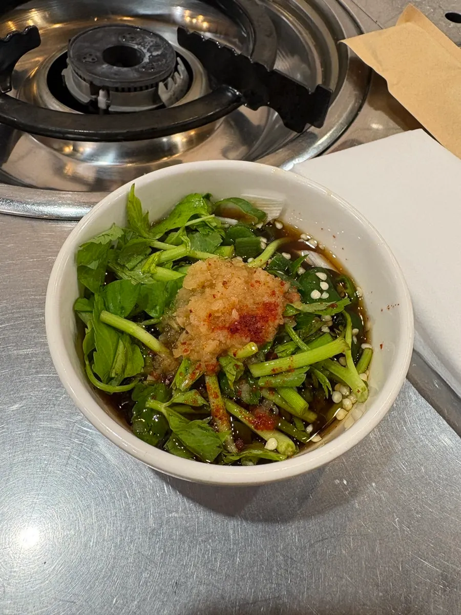 Small dish of minari garlic sauce on the table