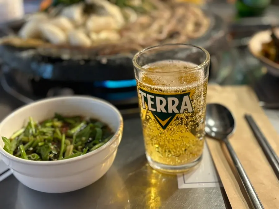 Beef gopchang cooking on the grill plate