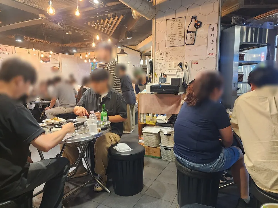 Front of Jinseong Hanwoo Gopchang Bangi branch with a waiting line
