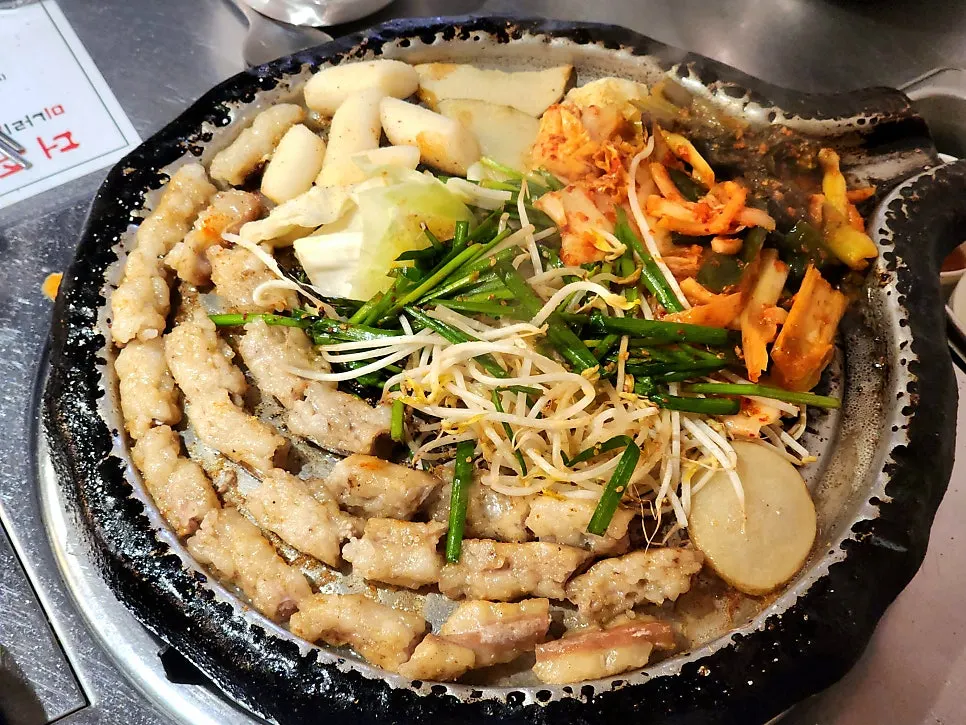 Pre-cooked beef gopchang on the grill plate