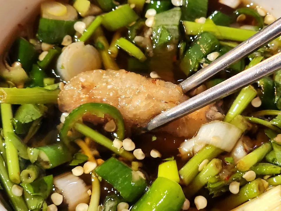 A full bowl of dipping sauce for the gopchang
