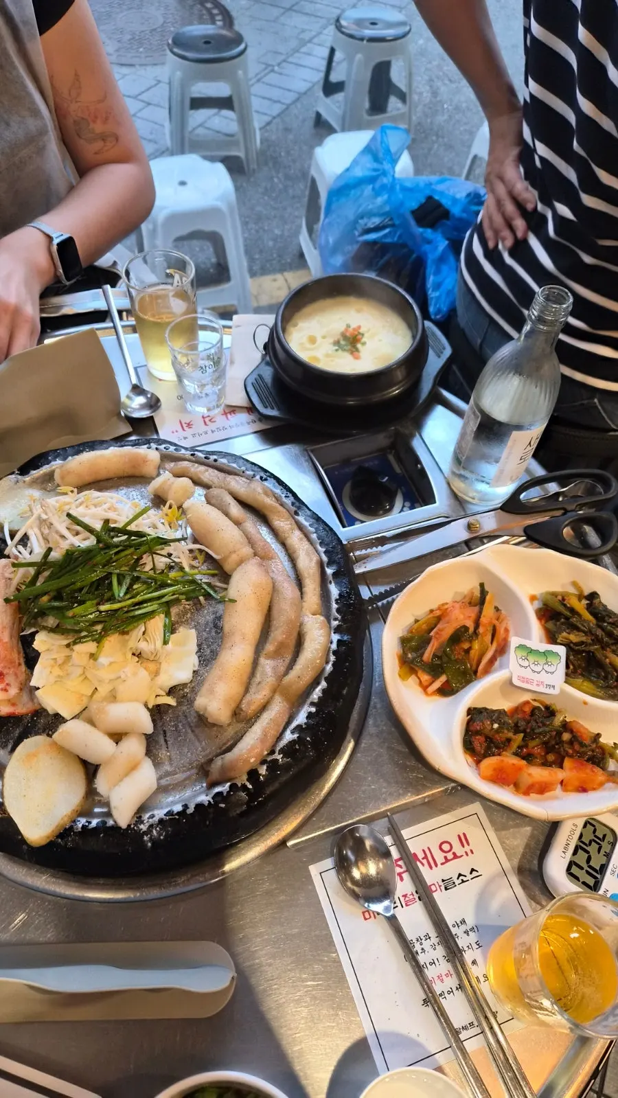 Hanwoo gopchang and daechang served with garlic chives, cabbage, and potatoes
