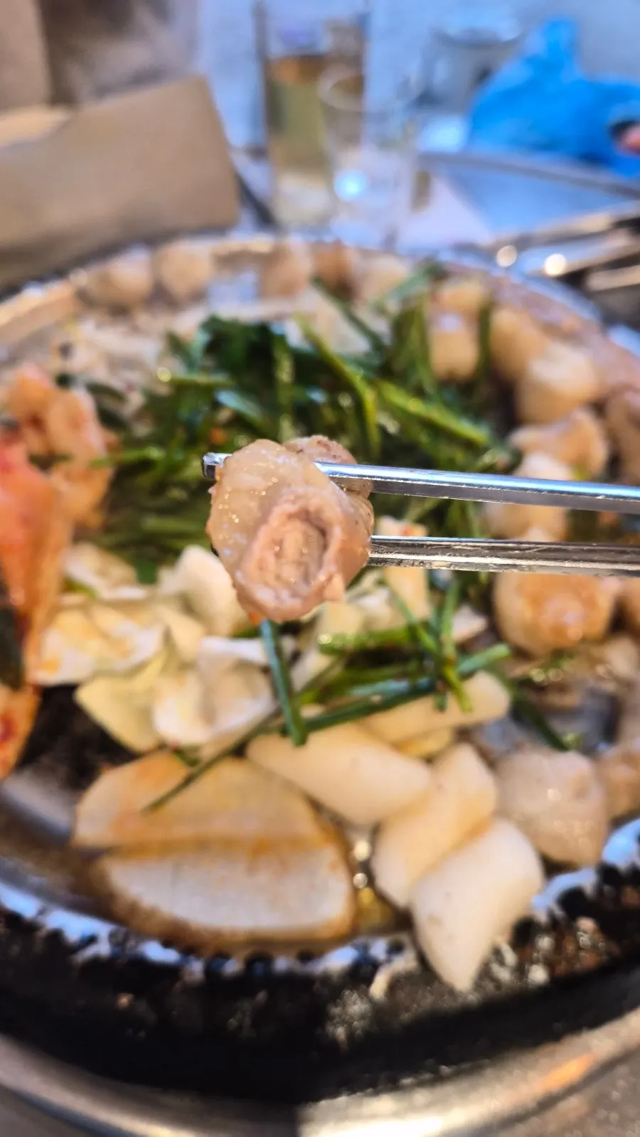 Beef gopchang sizzling on the grill