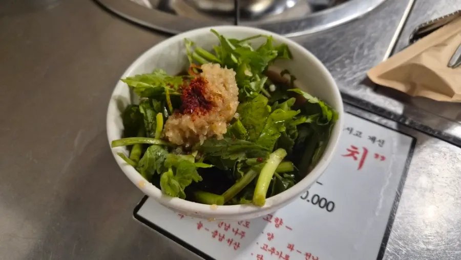 Minari-garlic pickle sauce and side dishes on the table