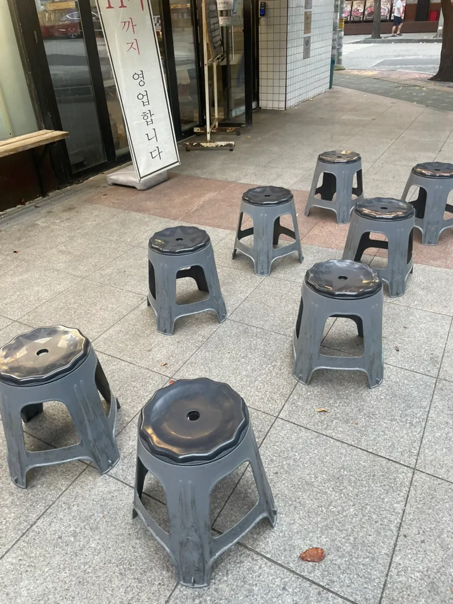 Entrance with waiting chairs set up outside the restaurant