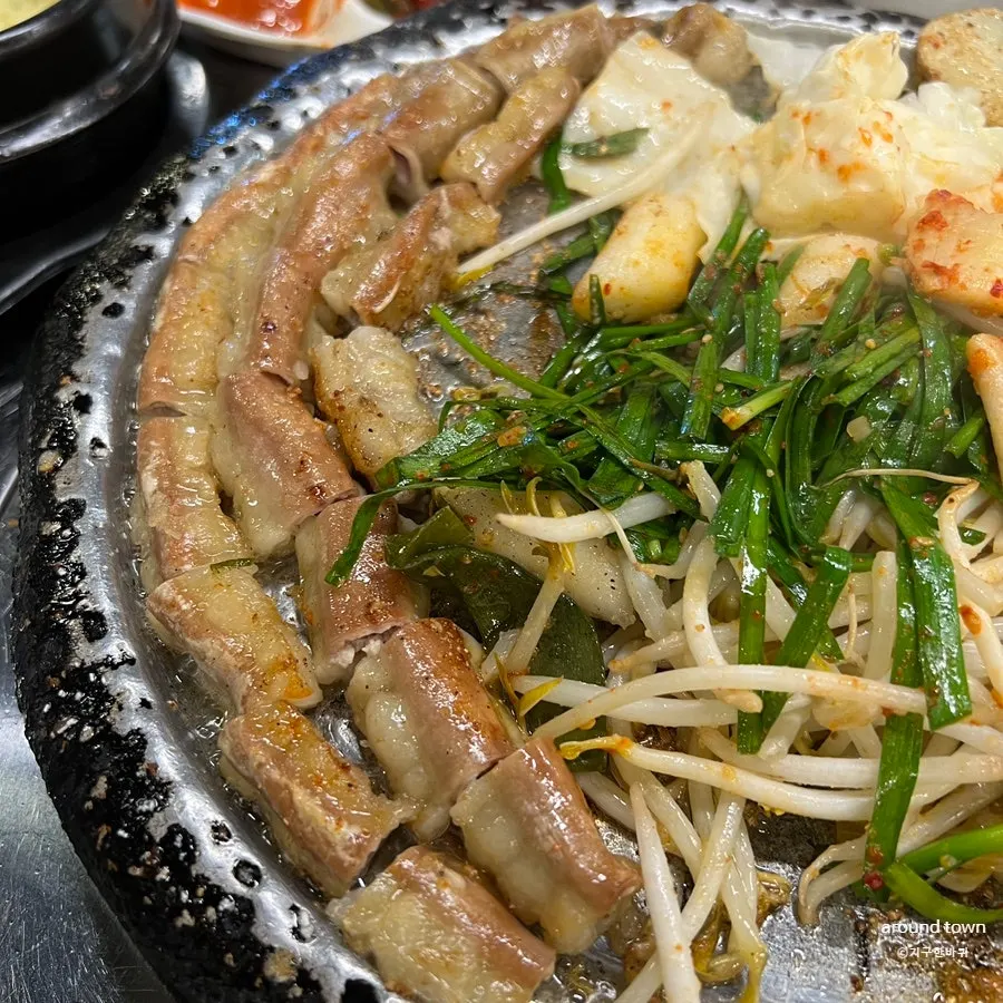 A spread of side dishes before the gopchang arrives