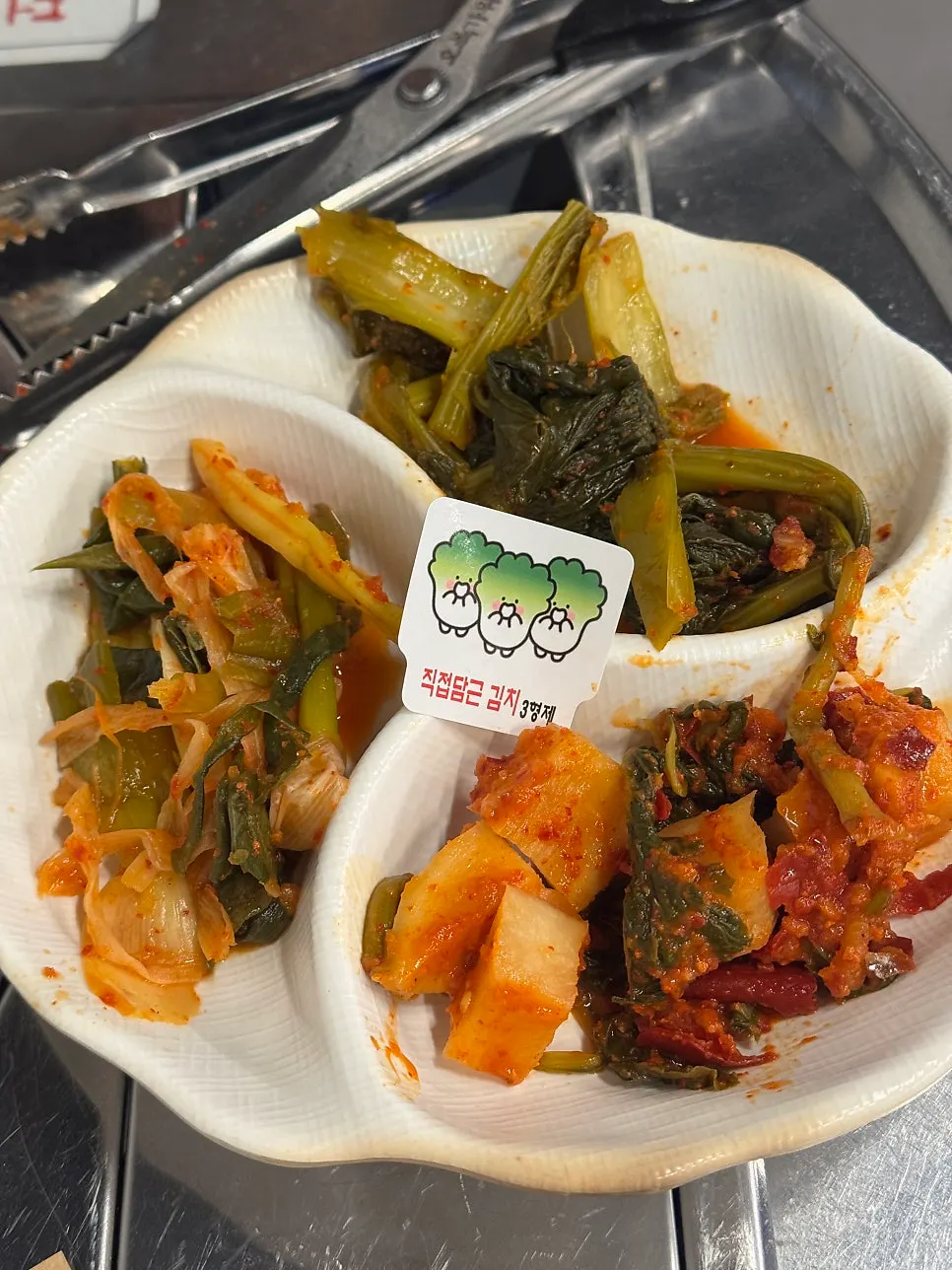 A bowl of minari pickled garlic sauce