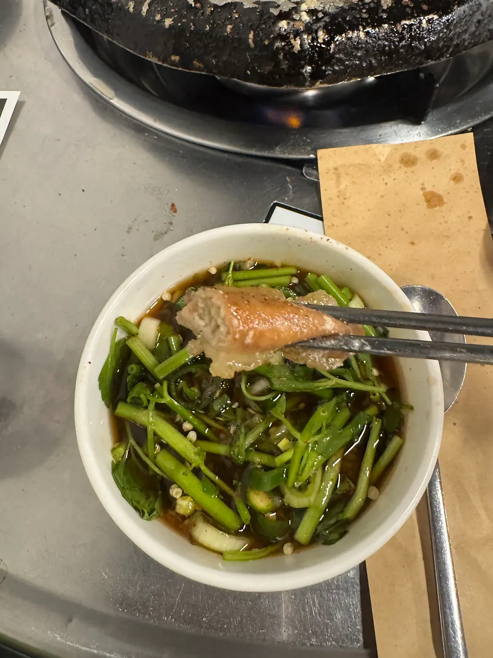 Hanwoo gopchang dipped in garlic sauce