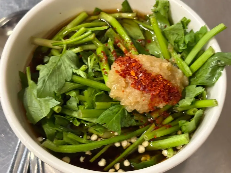 A piece of grilled gopchang off the grill