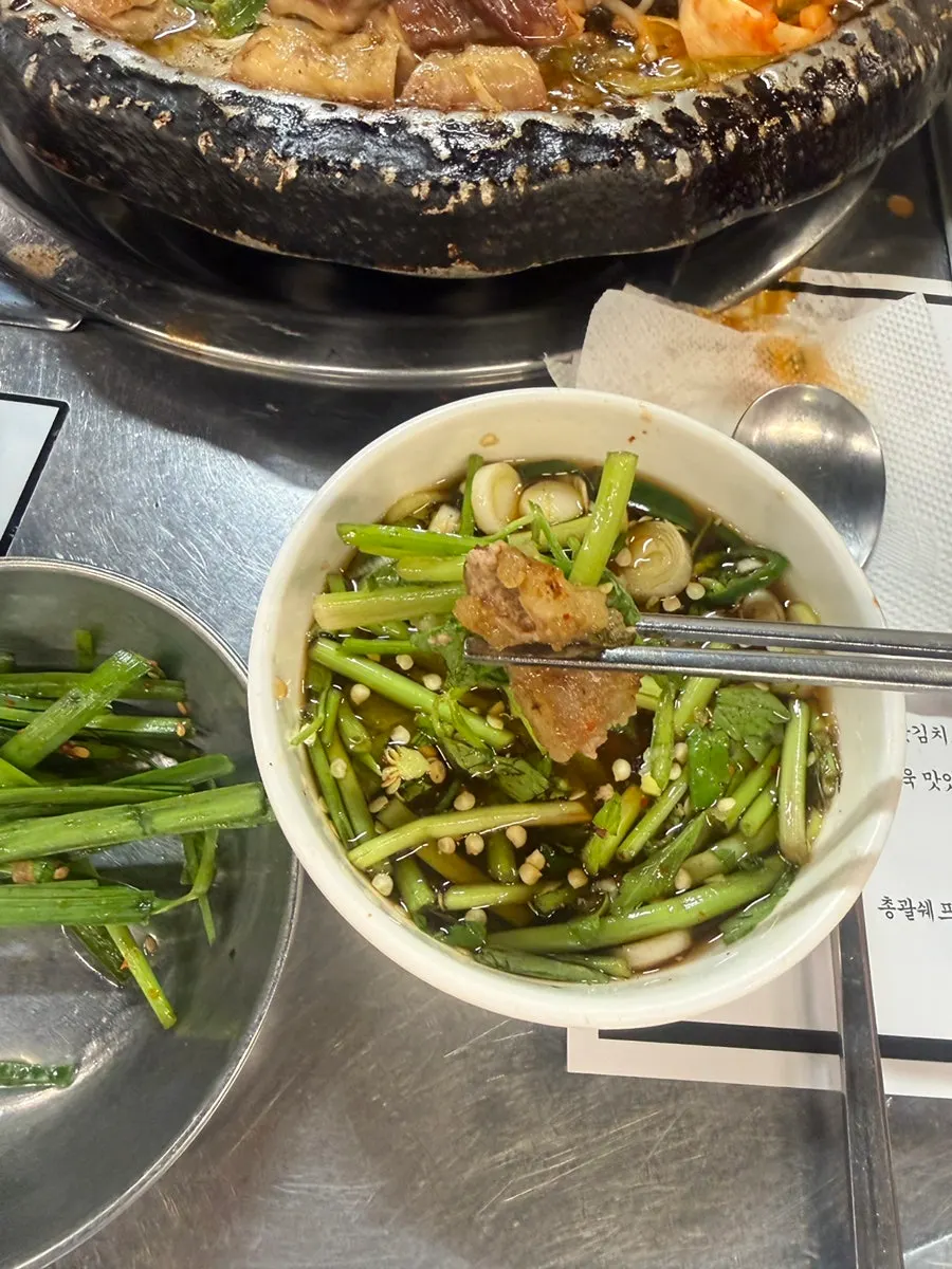 Daechang dipped in minari-garlic sauce