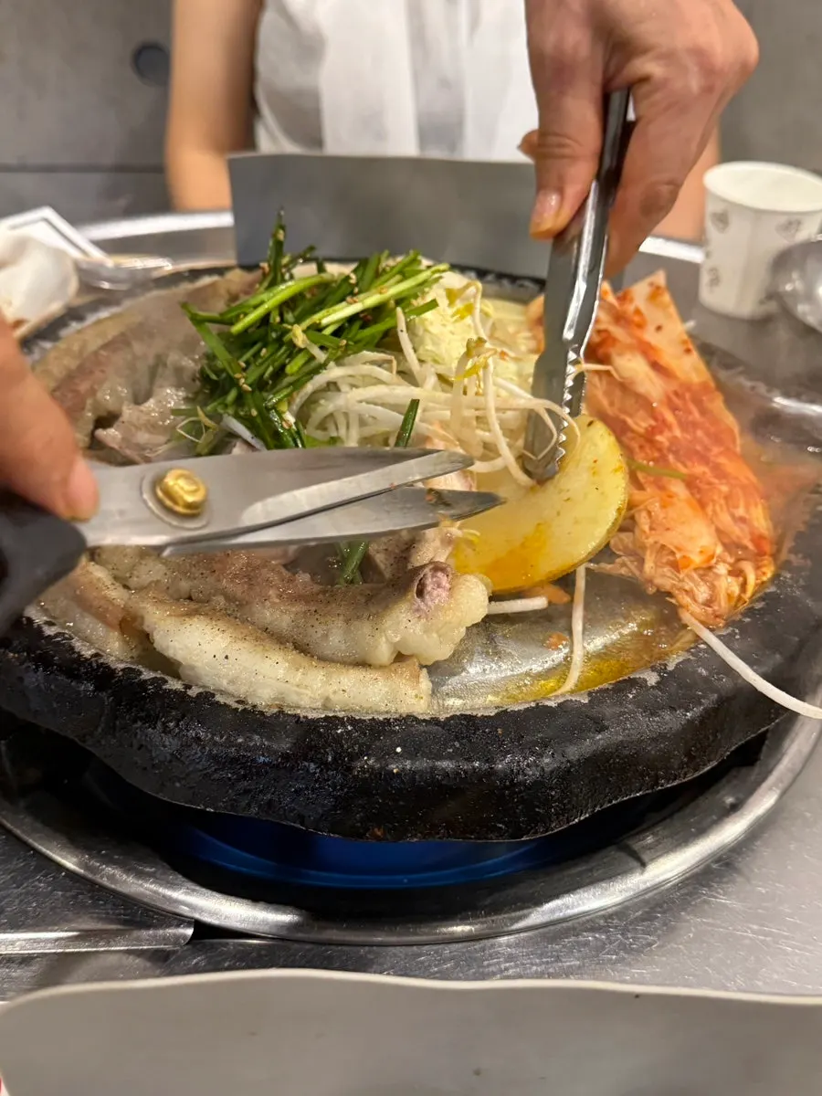 Grilled gopchang with side vegetables