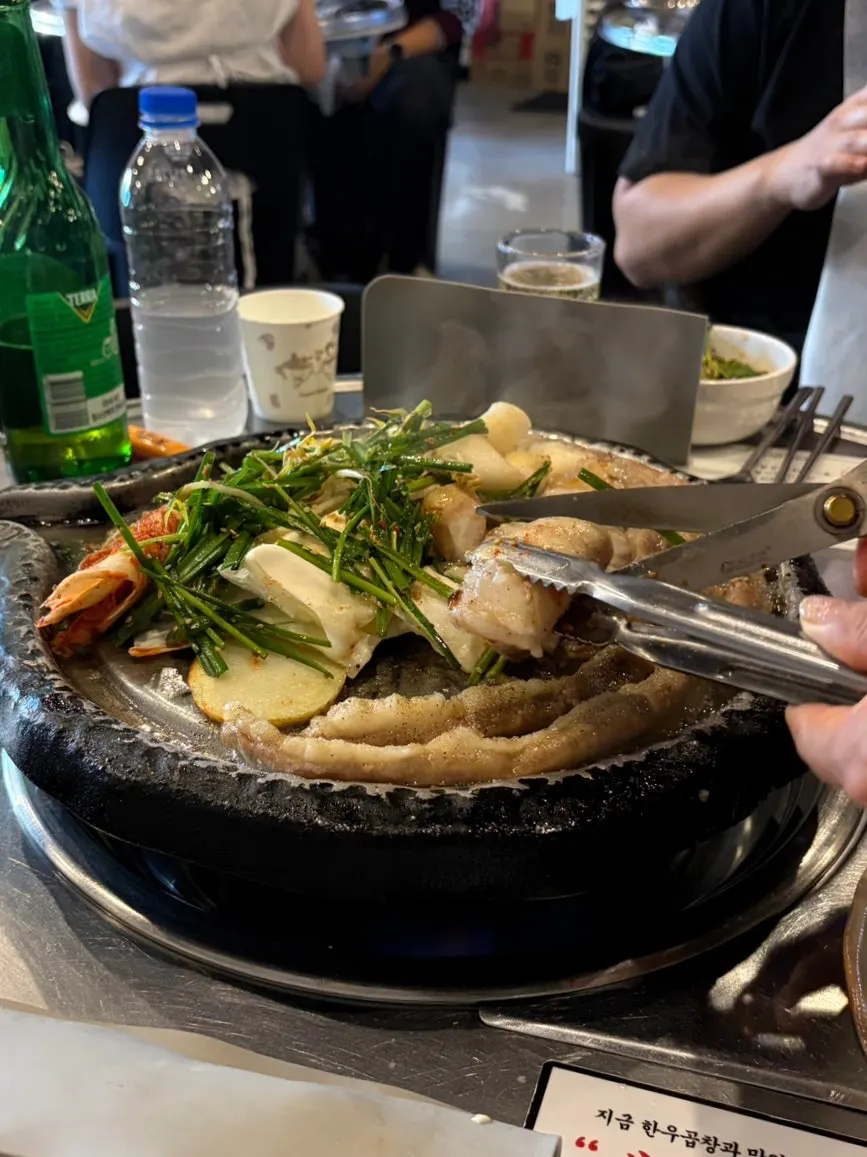 Close-up of gopchang and daechang starting to grill