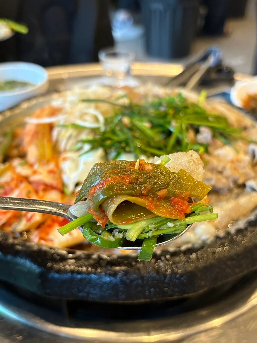Grilled gopchang dipped in minari and cheongyang chili sauce