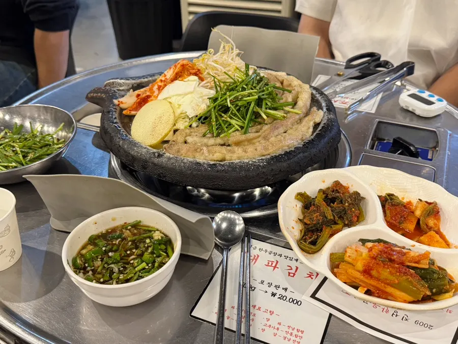 Staff member grilling the hanwoo gopchang