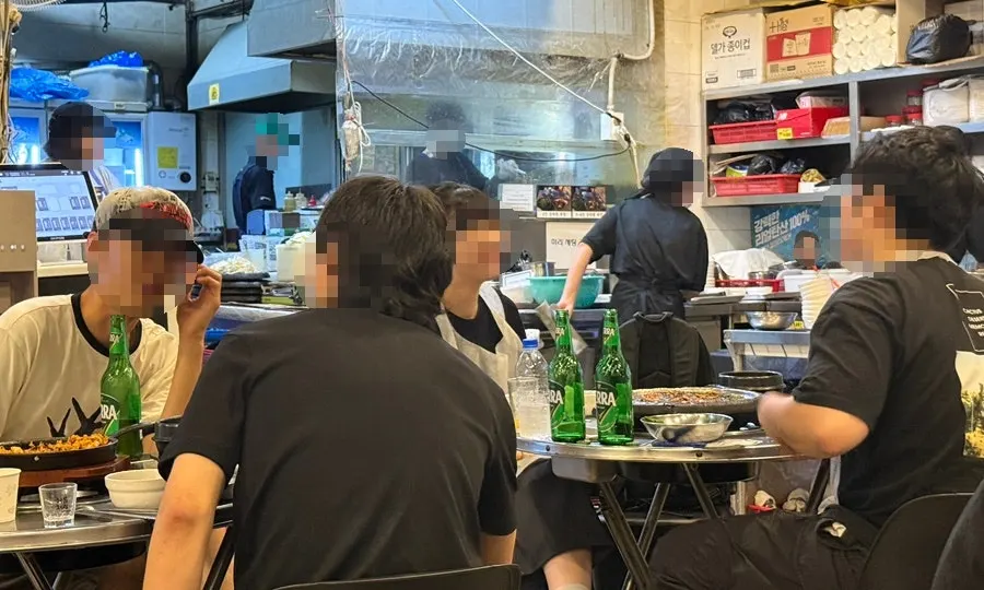 Spacious interior of the gopchang restaurant with long tables
