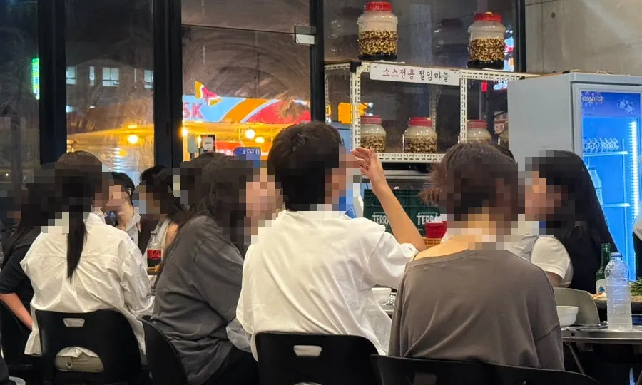 Full view of the restaurant packed with customers