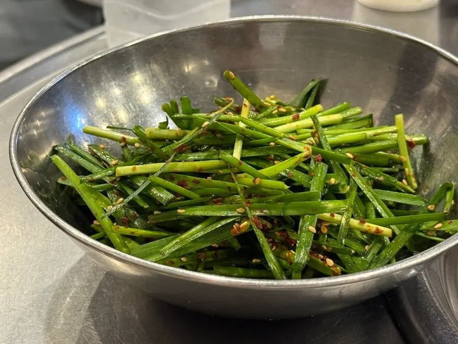 Chive salad served as a side dish