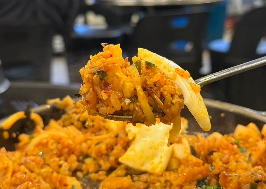 Yangbap crisped up on the pan's leftover heat